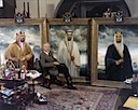 With finished paintings of the three kings of Saudi Arabia